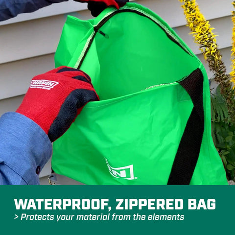 Person holding waterproof bag of Handheld Lawn Spreader With 25Lb Capacity For Grass Seed And Fertilizers, Waterproof Design