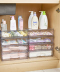 Clear Stackable Storage Drawers 2 Pack Wide Plastic Organizers used under bathroom sink for organizing lotions and hair accessories.