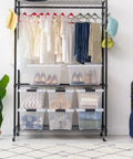 32 Qt BPA-Free Plastic Storage Bin With Lid, Stackable Tote for closet organization, visible under clothing rack on shelves.