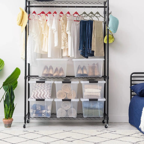 32 Qt BPA-Free Plastic Storage Bin With Lid, Stackable Tote for closet organization, visible under clothing rack on shelves.