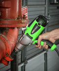 Person using Beast Half Inch Corded 120 Volt Impact Wrench With 400 Foot Pounds Nut Busting Torque on red pipe