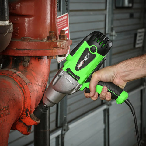 Person using Beast Half Inch Corded 120 Volt Impact Wrench With 400 Foot Pounds Nut Busting Torque on red pipe