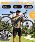 Huge 1500W Motor Electric Bike With Super Long Range And Swift Commuting Powers For Urban Rides Featuring Bold 26 Inch Tires And Heavy Duty Build For Any Terrain You Want To Crush Today. man carrying black electric bike with 26 inch tires, lightweight strong frame
