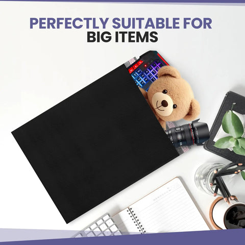 Black Poly Bubble Mailers 14.50x20 Inch Self Seal Large Padded Envelopes with teddy bear, camera, and keyboard inside.