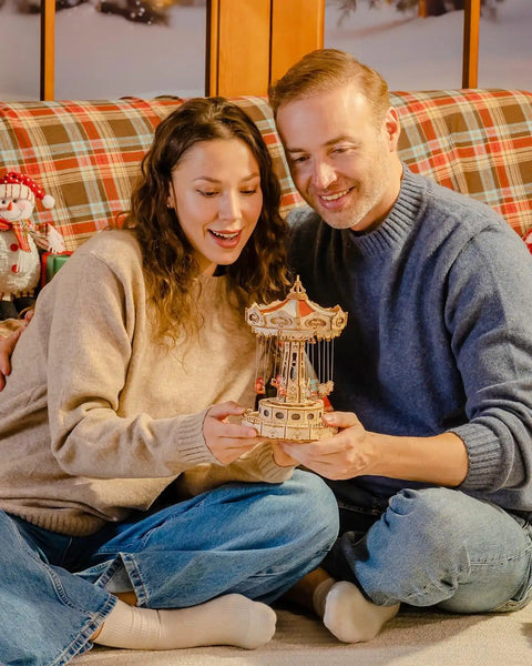 Couple admiring 3D Wooden Puzzle Music Box Kit With Led Rotating Swing Ride And Mechanical Model For Adults Diy Wood Craft