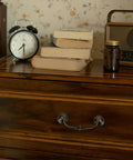 Antique Brass Drop Bail Pulls Set Of 4 With 4-1/4 Inch Center To Center Spacing installed on wooden dresser