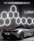 Hexagon LED Garage Lights 210W 25200LM 35 Pack Ultra Bright Ceiling Panels For Garage Workshop Gym Car Detailing Barber Auto Shops 6500K Daylight CRI Over 85 True Color Illumination installed on wall behind silver sports car