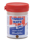 Jar of Timber Mate water-based wood filler with red lid, suitable for interior repairs, non-shrinking, 8 oz size hardwood application.