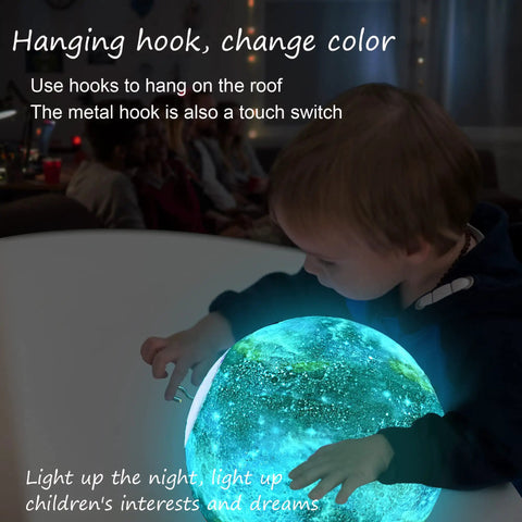 Child interacting with 7.9 Inch Large Moon Lamp With Galaxy Starry Surface, 16 Color Modes, Remote Control And Touch Sensor