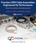 Precision OEM cable assemblies displayed with wires and connectors in a custom setup, showcasing audio, video, network, and power solutions.