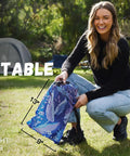 Woman holding folded inflatable couch air lounger chair for camping and beach trips, lightweight and portable