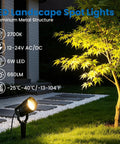 Outdoor evening garden with All In One Low Voltage Landscape Lighting Kit With Six 6W LED Spot Lights illuminating a tree