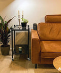 Living room scene with utility cart using 5/16 UNC Threaded Stem 2 Inch Swivel Caster Wheels, adjacent to a brown couch.