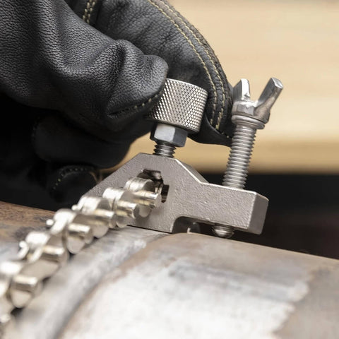 Close-up of Pipe Alignment Chain Pliers Built Tough For Precise Welding, adjustable stainless steel contacts with nickel plated chain.