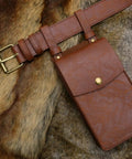 Easy Adjust Vintage Brown Leather Waist Belt With Heavy Duty Industrial Buckle and matching pouch on soft fur background.