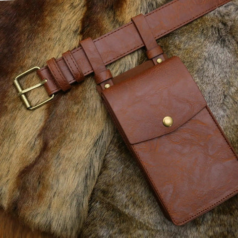 Easy Adjust Vintage Brown Leather Waist Belt With Heavy Duty Industrial Buckle and matching pouch on soft fur background.