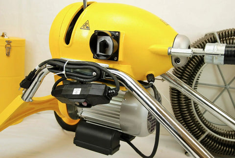 Real Deal Sectional Sewer Snake Machine 1.5 HP Drain Cleaner with motor detail, yellow casing, and power switch.