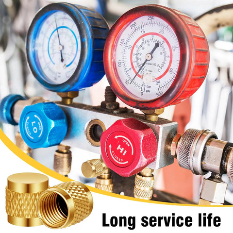 Close-up of HVAC gauges with Bulk Pack Of 50 Quarter Inch Flare Brass Valve Caps With Neoprene O Ring Seal for plumbing.