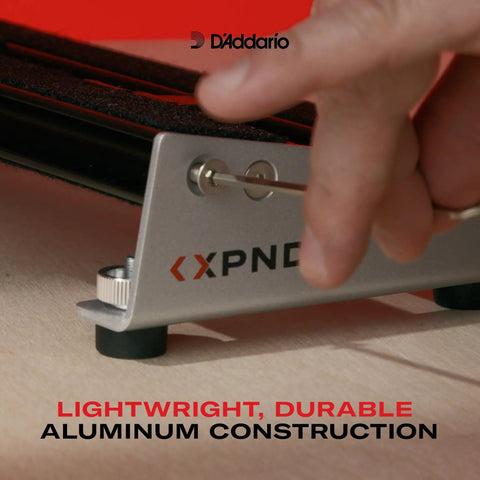 Close-up of setup on XPND Core Pedalboard Small Single Row Guitar Pedal Board Ultra Lightweight Aluminum Build Built Tough for Touring Expandable Design Lets You Add More Stomp Boxes While Keeping a Compact, Road Ready Rig. Black pedalboard setup highlight.