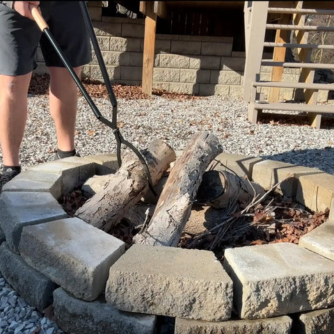 Person using 42 Inch Fire Tongs And Fire Poker Set Beefy Heavy Duty Detachable Log Grabbers on outdoor fire pit logs