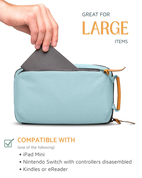 Hand placing tablet into Compact Travel Tech Organizer Bag For Cables Chargers And Gadgets With Leather Accents, Dusty Teal color