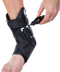 PTTD Ankle Support Brace for Left Foot Medium with Adjustable Velcro Straps and inflatable arch pump in use