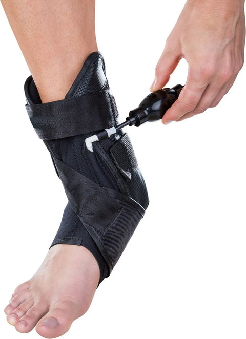PTTD Ankle Support Brace for Left Foot Medium with Adjustable Velcro Straps and inflatable arch pump in use