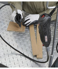 Pro Grade 107 Piece Rotary Multitool Kit With 35000 RPM Variable Speed Dial used for precision drawing on cardboard.