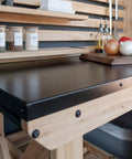 Close-up of 48 Inch Cedar Wood Buffet Hutch Serving Station With Galvanized Steel Countertop, showing spices and cutting board.