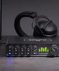 USB-C 6x4 audio interface with pro-grade studio-quality sound and ESS Sabre32 DAC, 120 dB dynamic range, on a desk with headphones