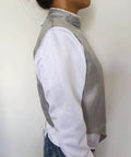 Side profile of Pro Grade Lame Fencing Vest For Foil And Saber Practice And Competition worn by a person, showing stand collar and fit.
