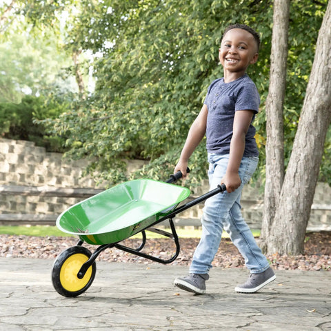 Child with John Deere Officially Licensed Kids Wheelbarrow For Backyard Projects 34 Inch Steel Wheelbarrow With Comfortable Vinyl Grips