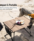 Ultralight Foldable Camping Table With Quick Setup, Sturdy And Stable Build Weighing Only 2.4 Lbs on beach with food and drink