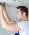 Person installing Pack Of 10 Flush Mount MR16 Spotlight Fixtures With Swivel Bracket, Dimmable LED Or Halogen Under Cabinet Lighting, GU5.3 Socket, Bulb Holder, Recessed Kitchen And Bathroom Lighting, Matte White on ceiling