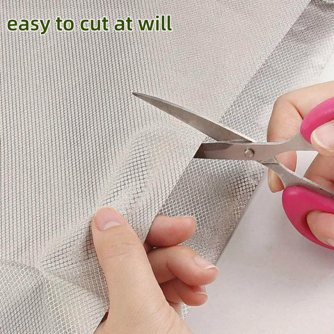 Person cutting Copper Nickel Faraday Cloth Shielding Fabric 39x43 Inches for WiFi 5G Cell Bluetooth GPS DIY projects.