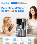 Women using Mineral Rich A2G Countertop Reverse Osmosis System With Hot And Cold Water On Tap, 6 Stage Filtration, on kitchen counter.