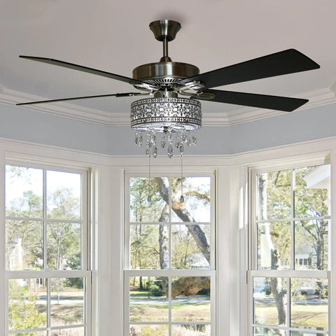 Drop Dead Gorgeous 52 Inch Crystal Chandelier Ceiling Fan With Integrated LED Lights And Smooth Airflow Featuring Satin Nickel Finish Plus K9 Hanging Crystals For Truly Top Shelf Room Makeovers in a bright room with windows.