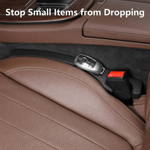 Universal Pu Leather Car Seat Gap Filler 2 Pack Console Crevice Blocker Keeps Phones Keys Wallets Safe Straight Up showing brown leather and key fob.