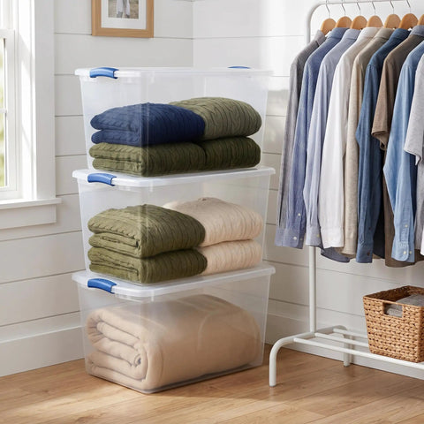 Hella Tough 66 Quart Clear Plastic Storage Bins With Secure Twist Latches And Smart Stack Design, holding folded blankets.