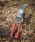 ClassicCUT Forged Bypass Hand Pruner for Pruning Flowers and Shrubs Three Quarter Inch Cutting Capacity with Red Handles on Soil
