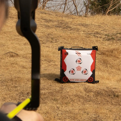Durable Portable Bag Archery Target 40x40 with high density core placed on dry grass for outdoor practice with bow