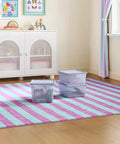 Purple 18 Gallon Plastic Storage Bin With Snug Snap Lid, Hella Spacious Stackable Tote For Seasonal Threads, Holiday Gear, And Dorm Room Stashing, Quick Wipe Down Space Saving Crate arranged on striped rug.