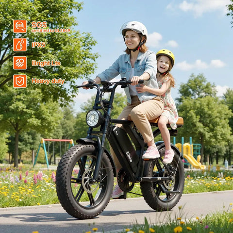 Powerful Electric Bike For Adults With 1500W Peak Motor And 60 To 80 Mile Range with rider on park path, showcasing side view.