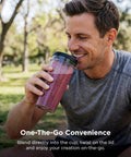 Heavy Duty Personal Blender Featuring 900W Push To Blend Motor And Pro Extractor Blades Crushing Ice For Nutrient Dense Smoothies Including Three Grab And Go 20 Oz Serveware Cups In Classic Silver, man enjoying a smoothie outdoors.