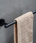 Matte Black 5 Piece Bathroom Accessories Set, Wall Mounted Towel Bar holding beige towel, Dope Stainless Steel Hardware, Modern Minimalist Bath Upgrade