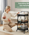 Woman using 3 Tier Foldable Rolling Cart With Wheels Grab-And-Go Space Saving Utility Organizer with baby items in nursery.