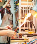 Person working with melting equipment in a metallurgy lab, showcasing the use of Rectangle Graphite Block And Disk Ingot High Purity Graphite Electrode