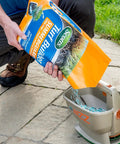 Person using No Crank One Touch Battery Powered Spreader for Fertilizer Seed and Ice Handheld Spreader with EdgeGuard Tech