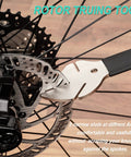 Rotor Truing Fork 2 In 1 Bike Rotor Tool And Hydraulic Piston Press For Bicycle Disc Brakes shown in use on a bike wheel.