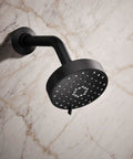 Awaken G110 Three Function Showerhead With Wall Mount, oil rubbed bronze finish, mounted on marble wall background.